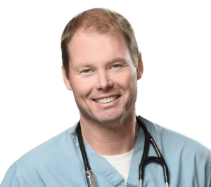 A headshot of Dr.Kevin Spencer in his scrubs with a stethoscope