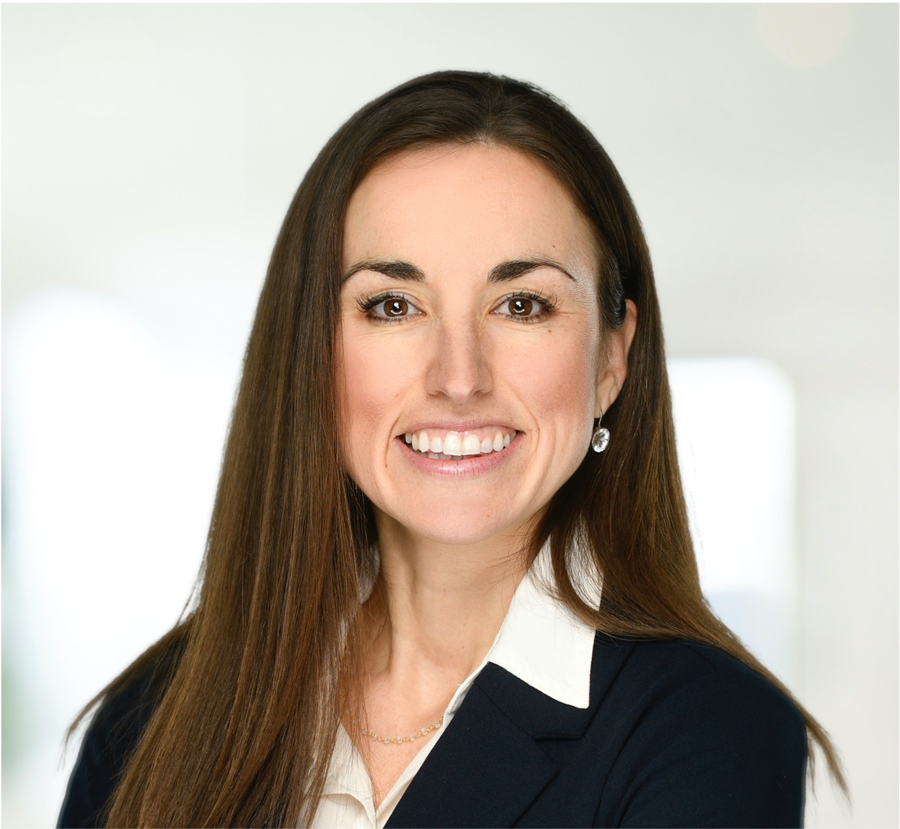 A headshot of Jennifer against a white background